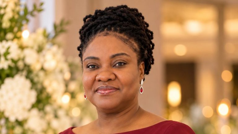 Lavern P. Oliver in a burgundy dress with an updo
